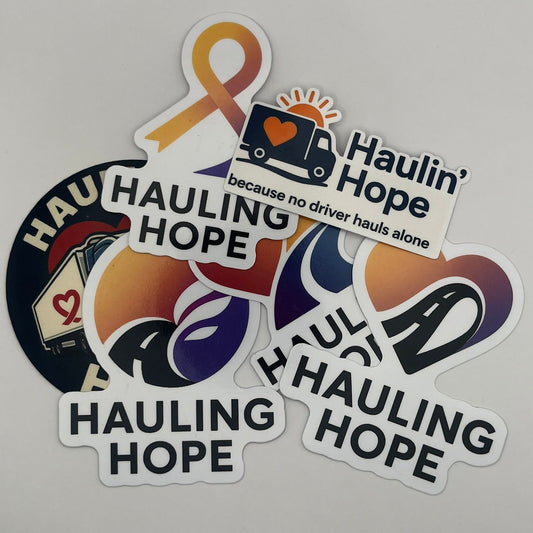 Stickers with 'Hauling Hope' and related graphics on a gray background