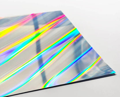 Holographic vinyl sheet with rainbow colors on a white background, labeled 'Oblique Beam'.