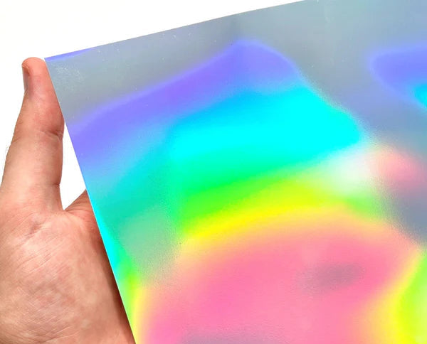 Holographic vinyl sheet with oil spill design held by a hand