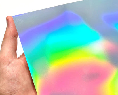 Holographic vinyl sheet with oil spill design held by a hand